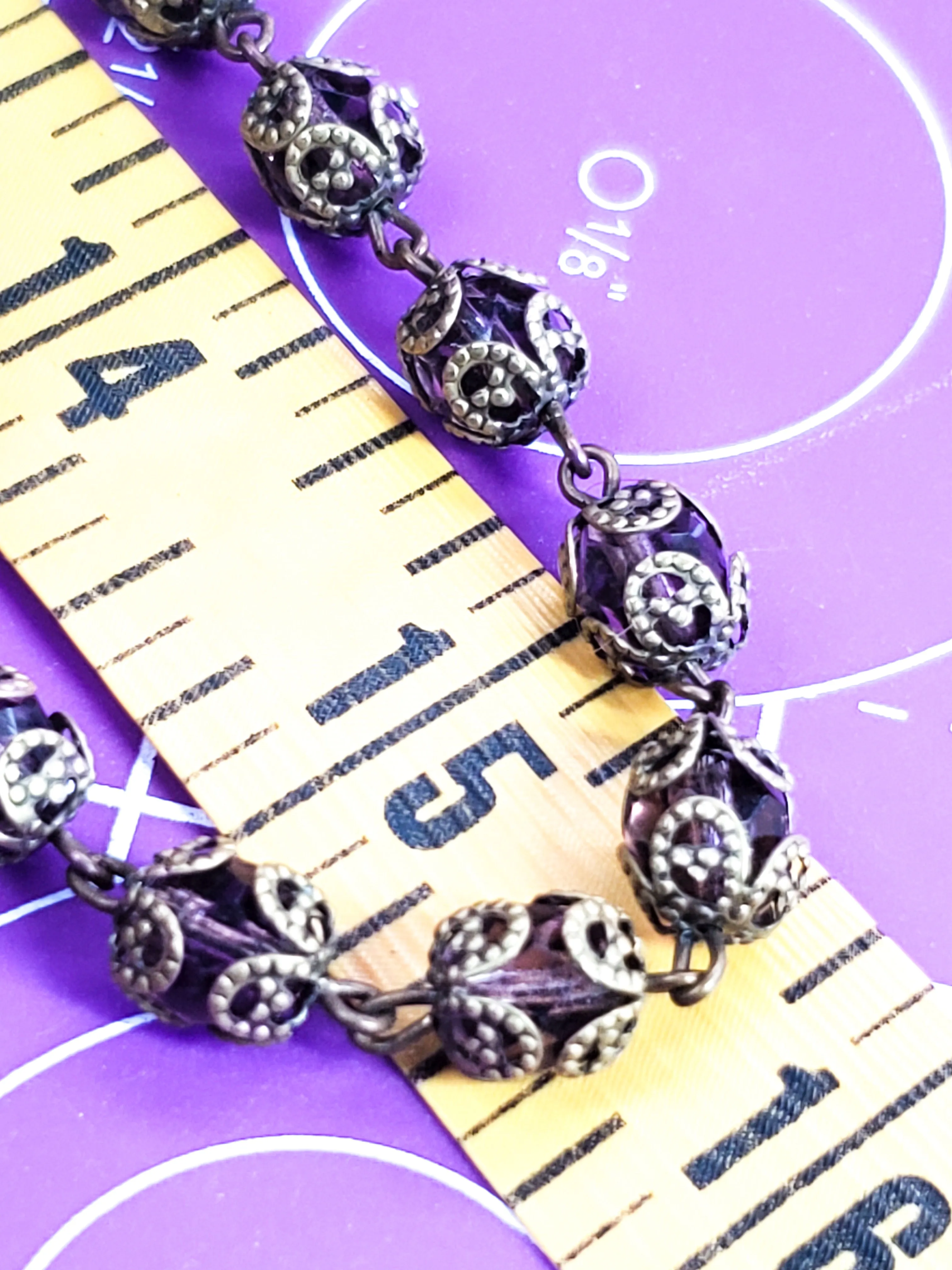 Long Venetian purple faceted glass vintage beaded necklace with brass flower caps