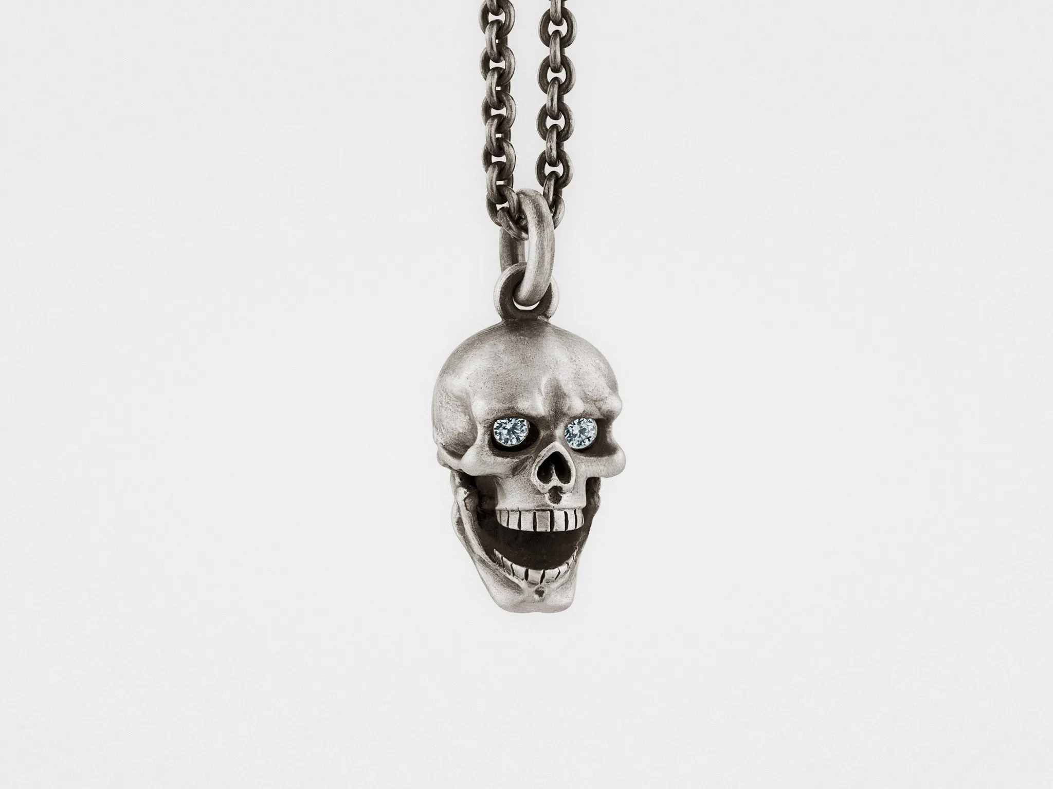 Skull Pendant with Hinged Jaw and Diamond Eyes in Sterling Silver