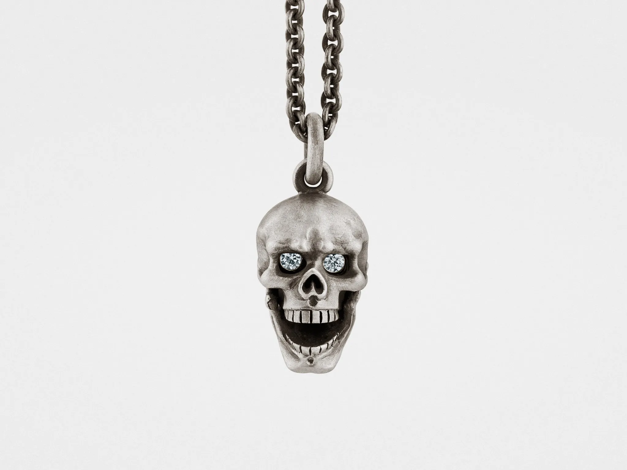 Skull Pendant with Hinged Jaw and Diamond Eyes in Sterling Silver