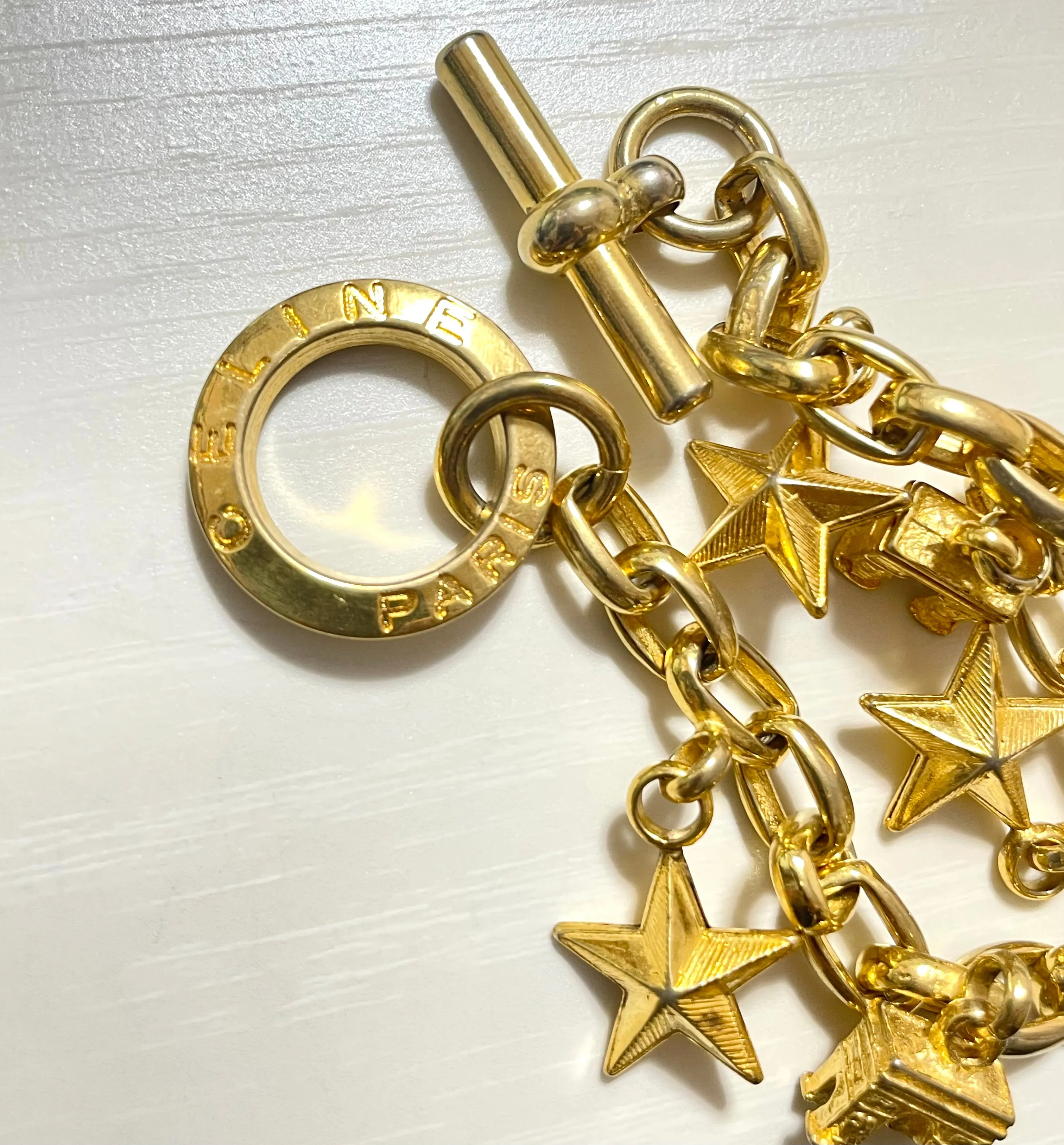 Vintage Celine chain bracelet with Triomphe and star charms. One-of-a-kind Celine jewelry. 061224ac1