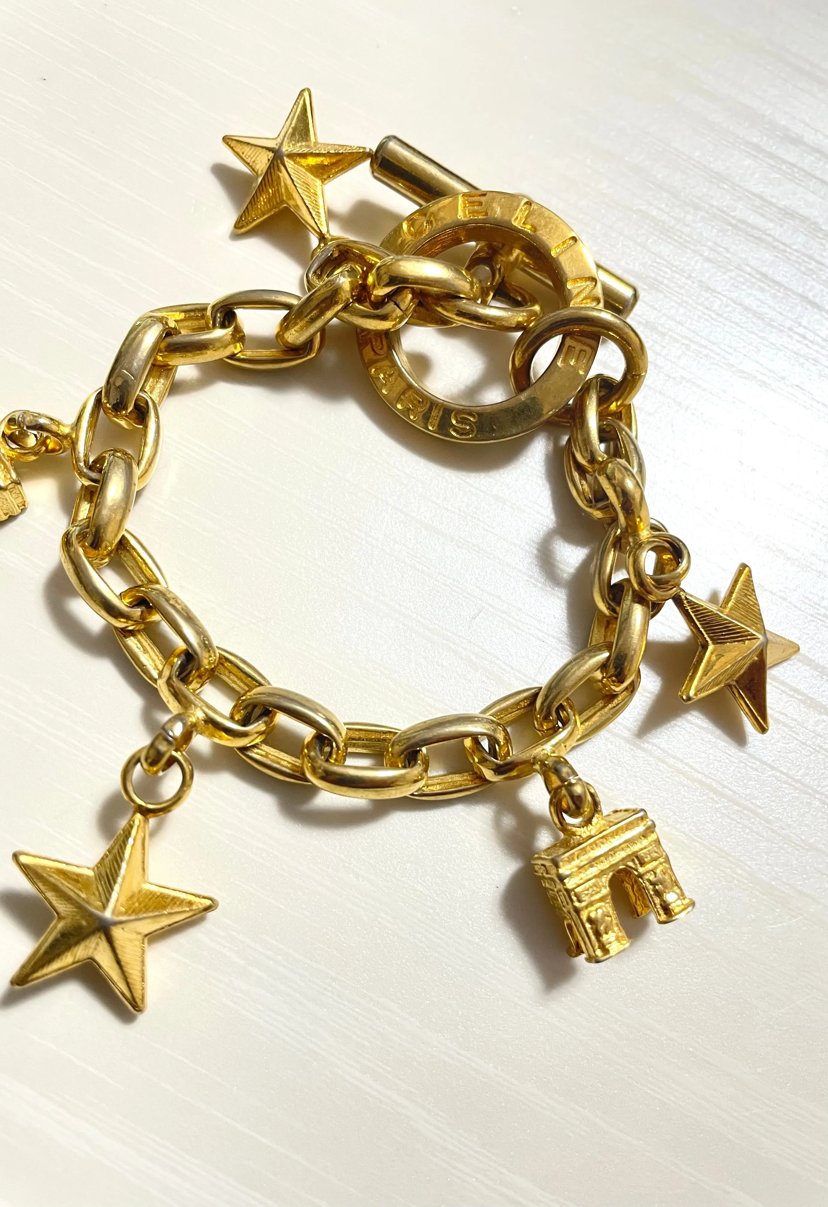 Vintage Celine chain bracelet with Triomphe and star charms. One-of-a-kind Celine jewelry. 061224ac1