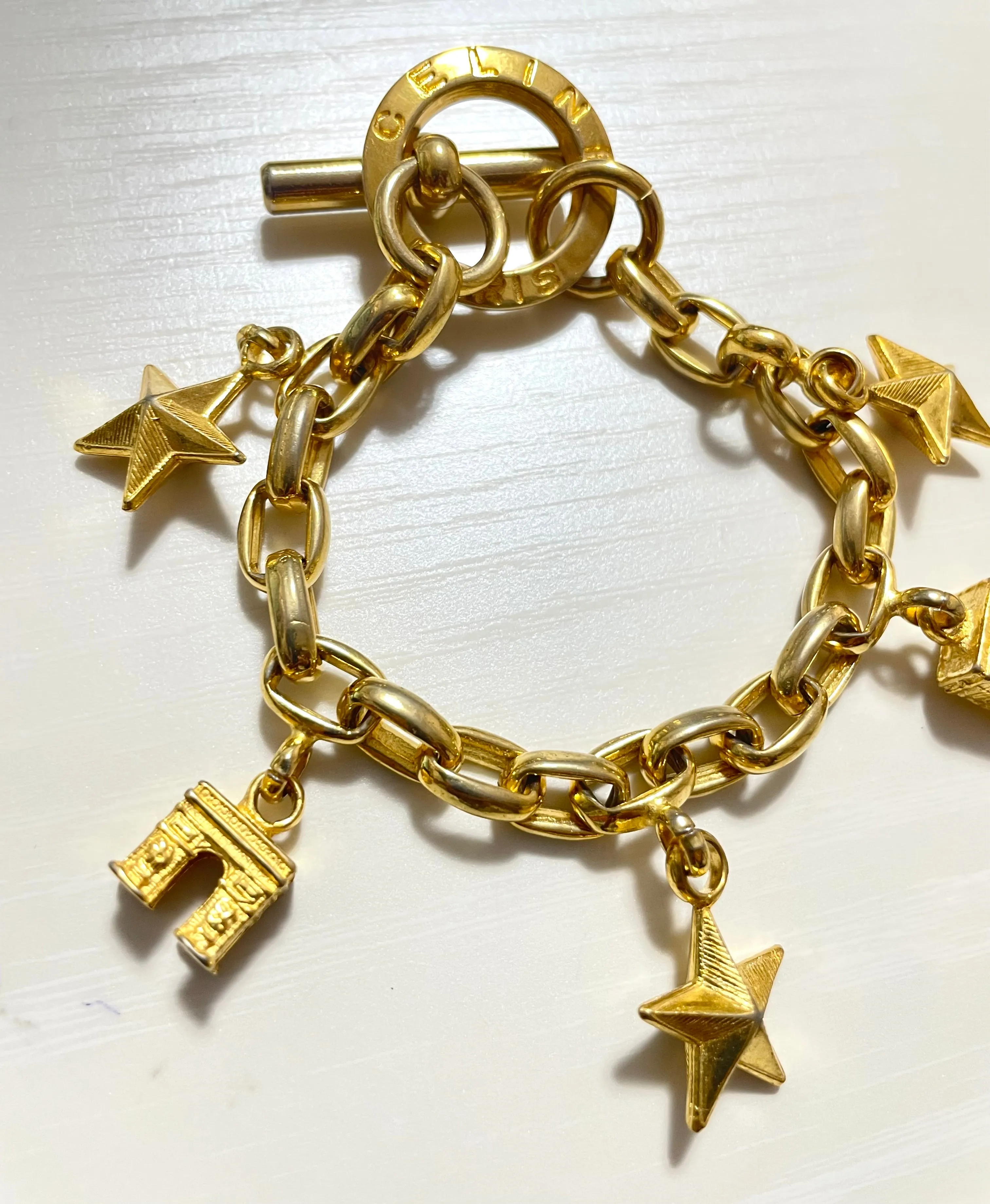 Vintage Celine chain bracelet with Triomphe and star charms. One-of-a-kind Celine jewelry. 061224ac1